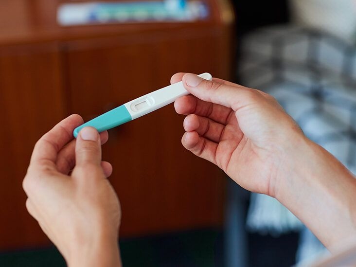 female-looking-at-pregnancy-test.jpg